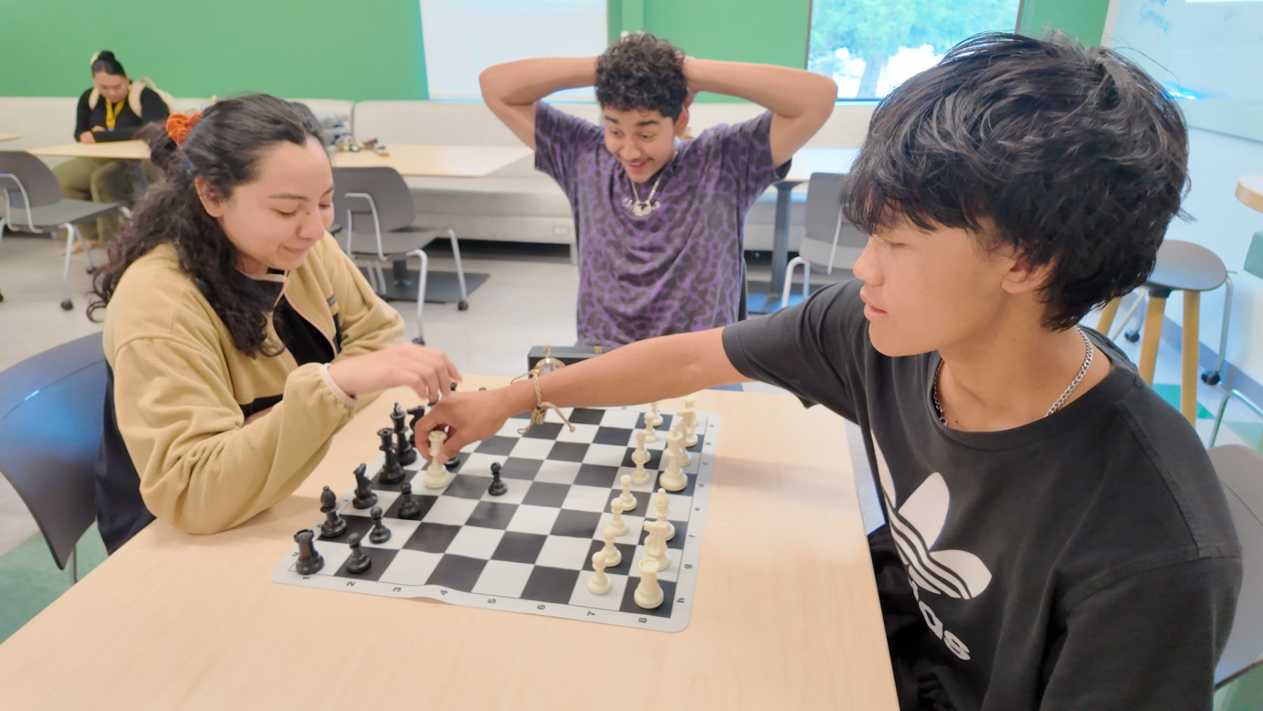 Students playing chess during a break
